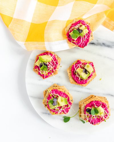 Beet Hummus, Avocado, & Micro Greens Cracker Bites made with Sprouted Seed Crackers Garlic and Herb Recipe