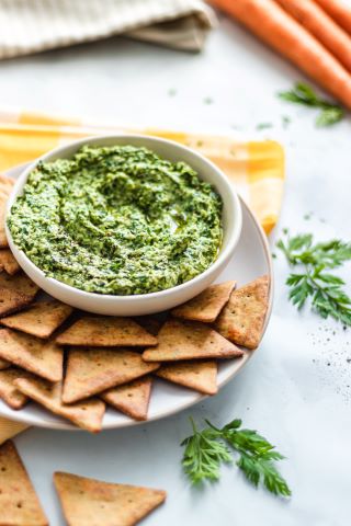 Upcycled Carrot Tops Pesto served with Mediterranean Herb Veggie Pita Crackers Recipe