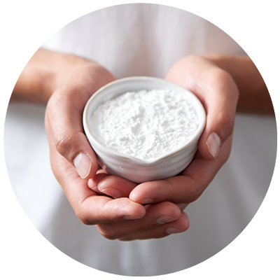 Arrowroot ingredient being cradled in a bowl  in hands, nothing artificial ever