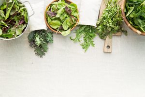 Various green vegetables spinach, romaine and herbs