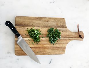 herbs.jpg Chopped up herbs on a cutting board to be used in recipes