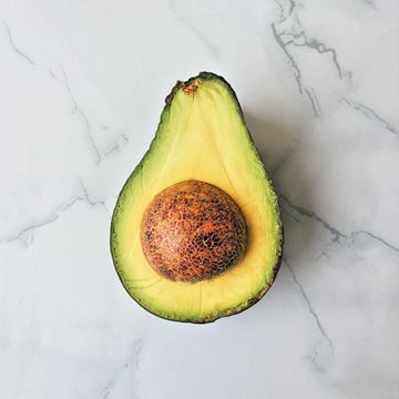 avocado-half-on-marble.jpg