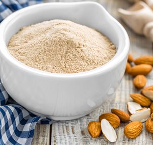 Almond flour in a bowl is a paleo approved food, and can be used to make healthy recipes