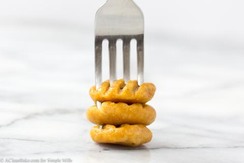 Three Grain Free Sweet Potato Gnocchi stacked on fork