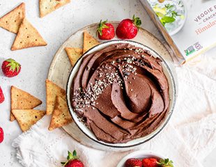 Bowl of Cacao and Avocado Hummus with Simple Mills pita crackers