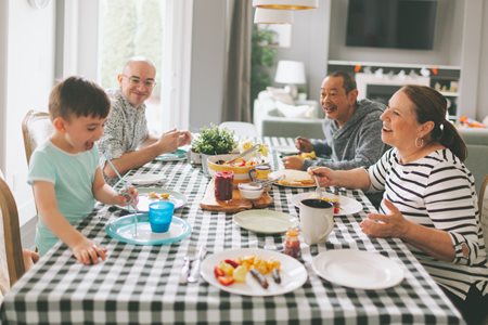 Family enjoying recipes around a dinner table.