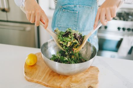 Woman tossing a salad 