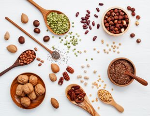 shutterstock_1044223210-copy.jpg Arial view of whole and ground nuts in wooden bowls and wooden spoons of varying sizes